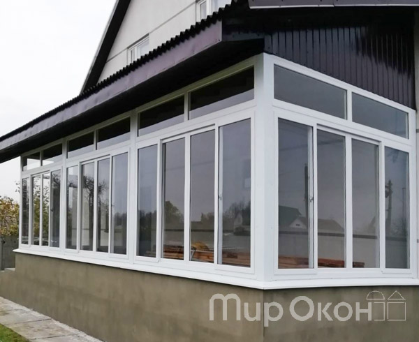 Остекление веранды раздвижными окнами ПВХ